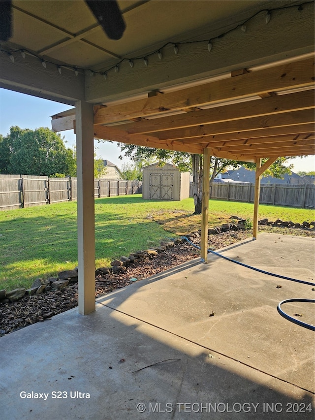 view of patio featuring a storage unit