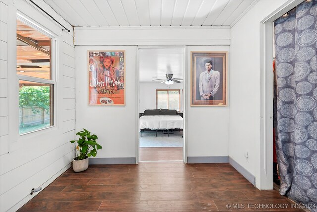 hall with dark hardwood / wood-style floors and wood ceiling