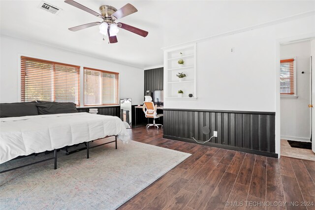 bedroom featuring multiple windows, ceiling fan, and dark hardwood / wood-style floors