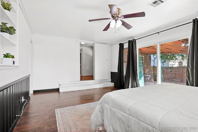 bedroom featuring ornamental molding, dark hardwood / wood-style flooring, and ceiling fan