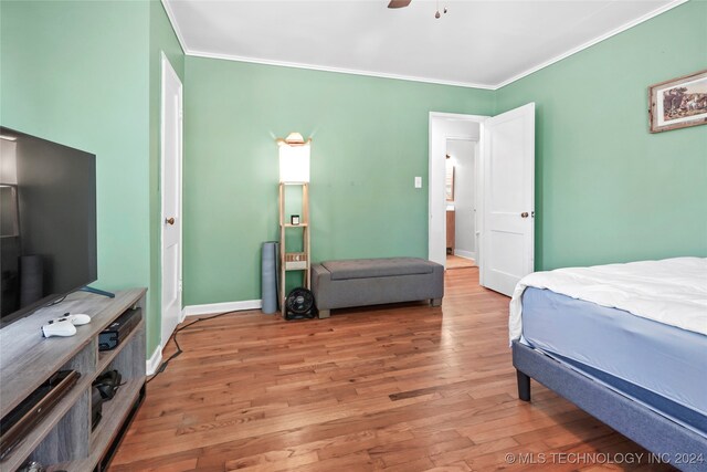 bedroom with ceiling fan, light hardwood / wood-style flooring, and ornamental molding