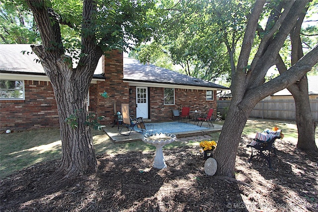 rear view of house featuring a patio