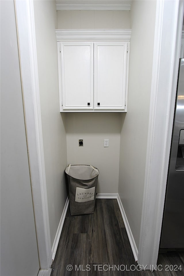 washroom with cabinets, dark hardwood / wood-style floors, and electric dryer hookup