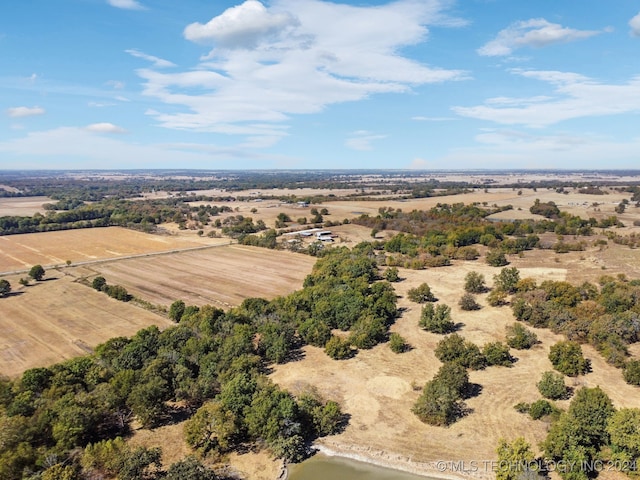 birds eye view of property with a rural view