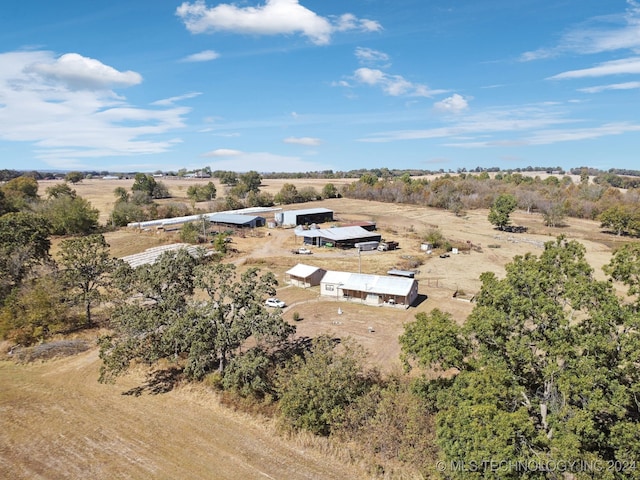 birds eye view of property with a rural view