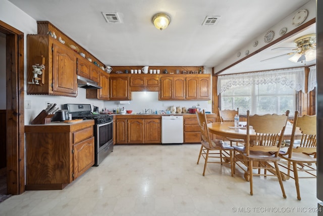 kitchen featuring gas stove, sink, white dishwasher, and ceiling fan