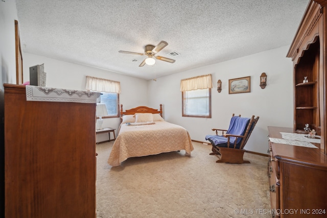 bedroom featuring ceiling fan, light carpet, and multiple windows