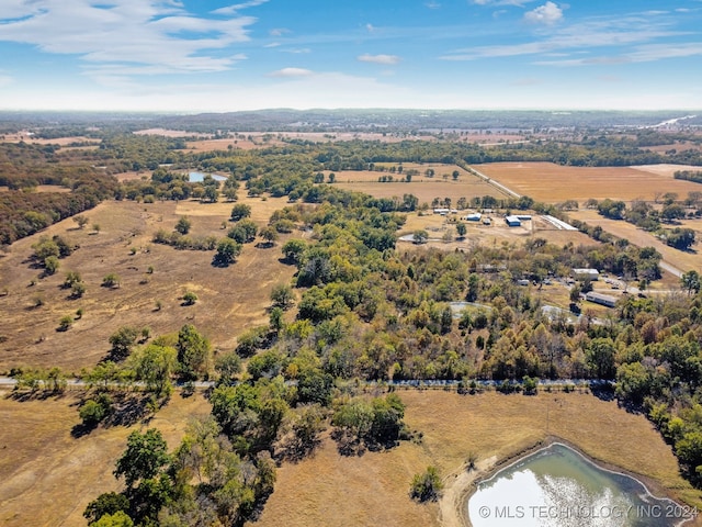 birds eye view of property featuring a rural view and a water view