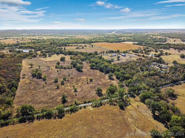 birds eye view of property featuring a rural view