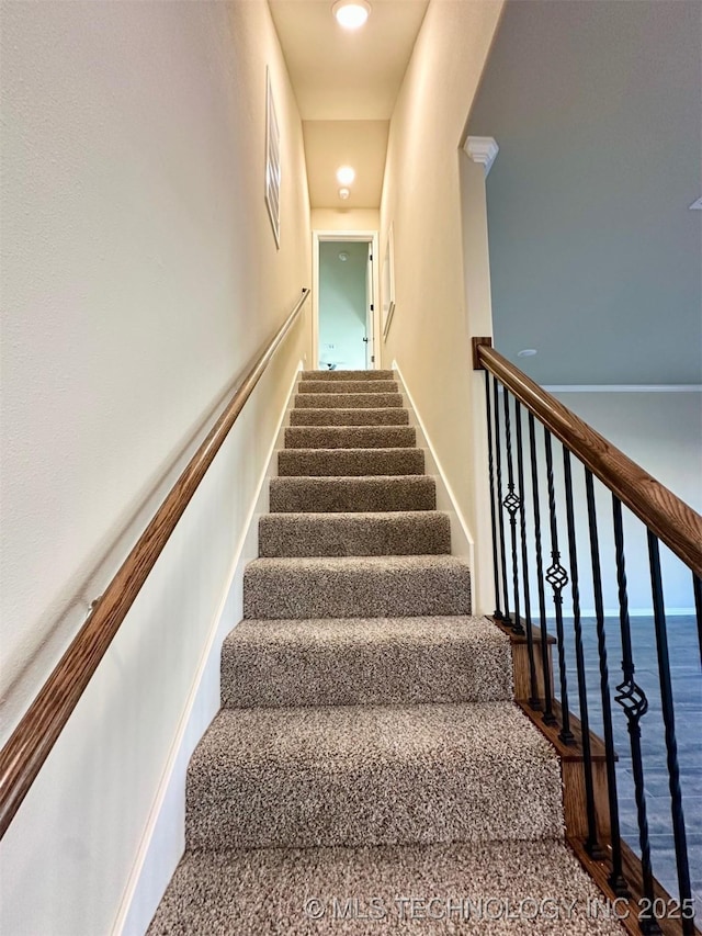 staircase featuring a water view