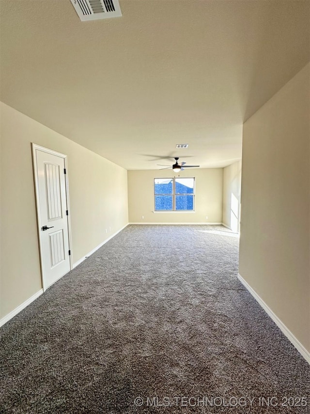 carpeted empty room featuring ceiling fan