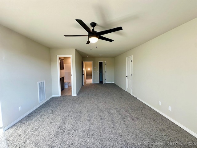 unfurnished bedroom featuring ceiling fan, connected bathroom, and carpet flooring