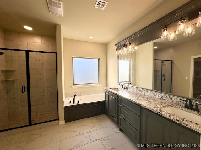 bathroom featuring vanity and separate shower and tub