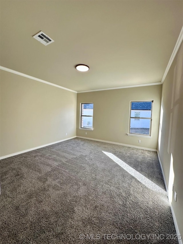 carpeted spare room with crown molding