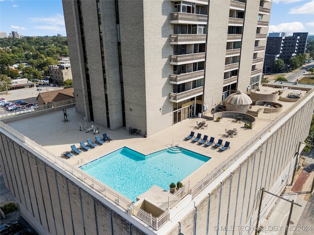 view of swimming pool featuring a patio area