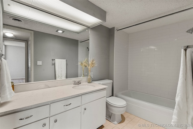 full bathroom featuring vanity, a textured ceiling, shower / tub combo, tile patterned floors, and toilet