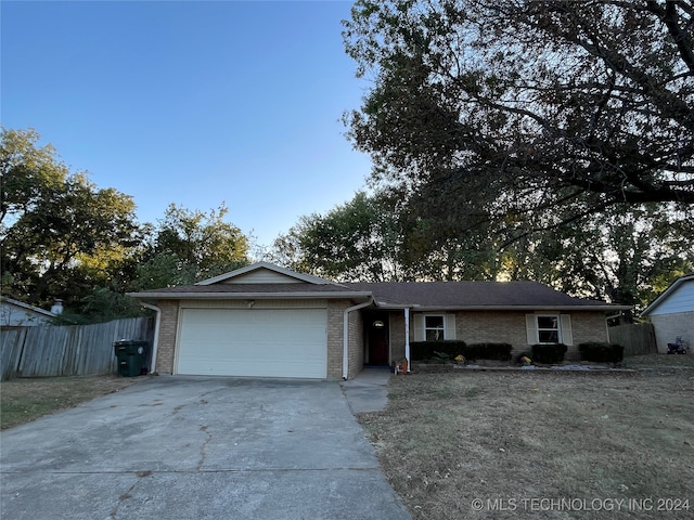 ranch-style house featuring a garage