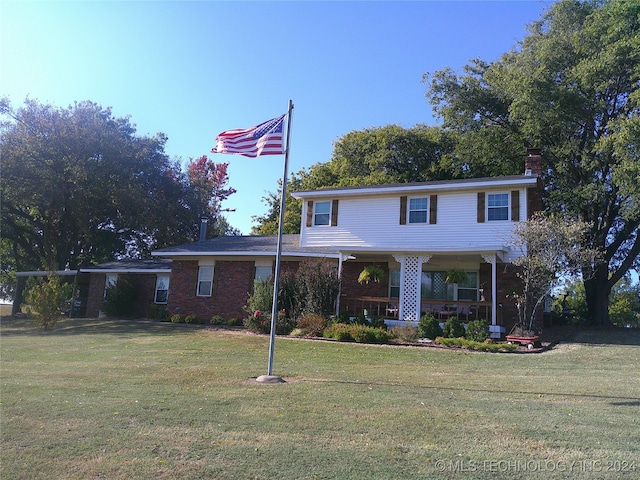 view of front of home with a front lawn and covered porch