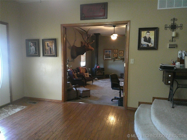 interior space with hardwood / wood-style flooring and ceiling fan