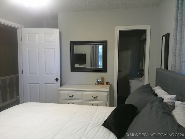 bedroom with a textured ceiling