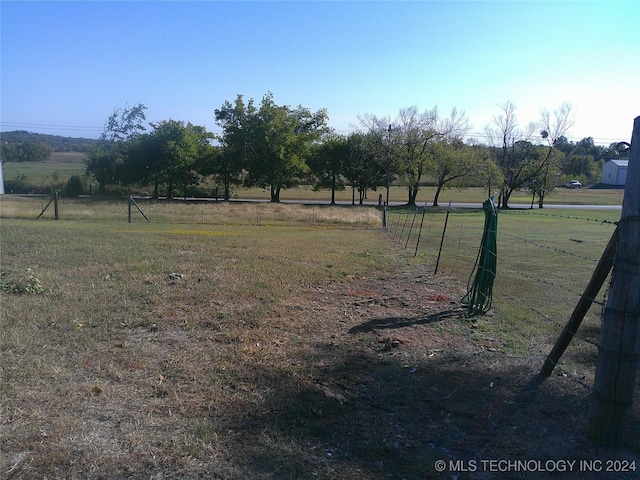 view of yard with a rural view