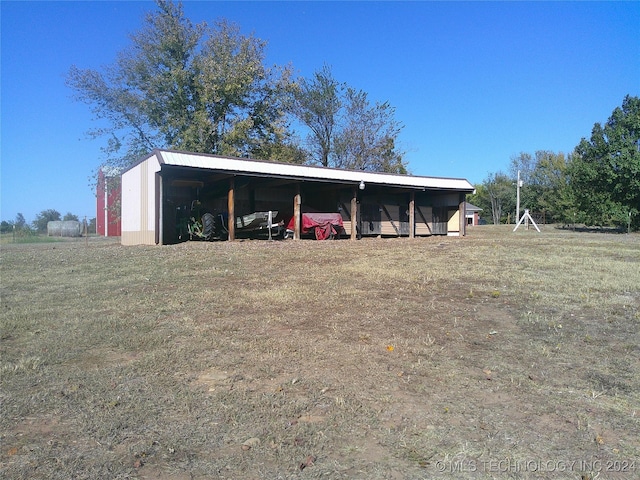 view of outdoor structure featuring a lawn