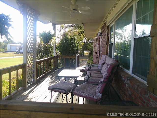 wooden deck with ceiling fan