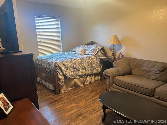 bedroom featuring dark hardwood / wood-style flooring