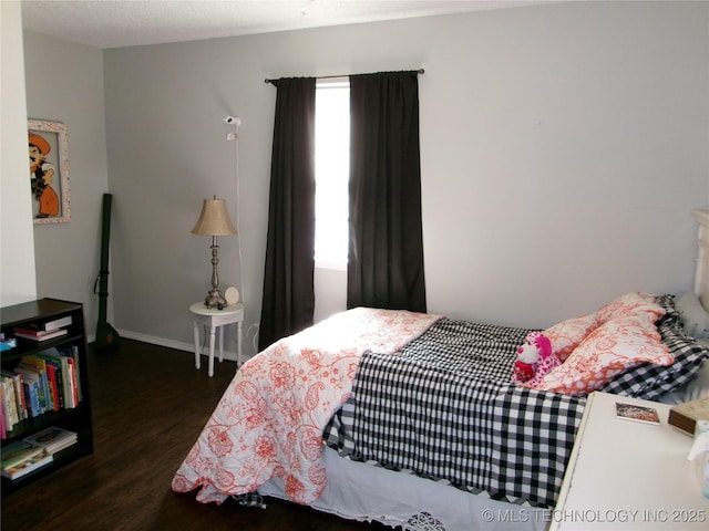 bedroom featuring dark wood-type flooring