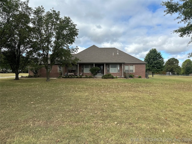 ranch-style house with a front yard