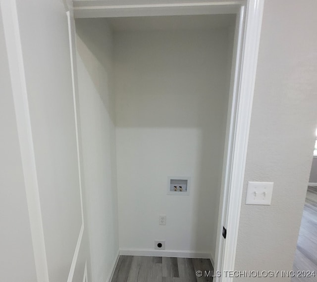 laundry room with hookup for a washing machine, hardwood / wood-style floors, and electric dryer hookup