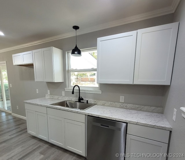 kitchen featuring ornamental molding, sink, white cabinetry, and stainless steel dishwasher