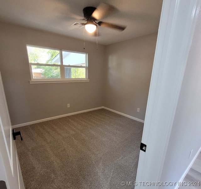 carpeted empty room with ceiling fan