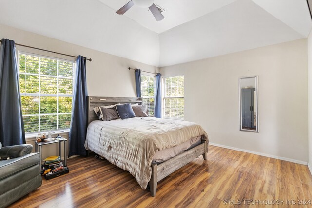 bedroom featuring lofted ceiling, hardwood / wood-style floors, and ceiling fan