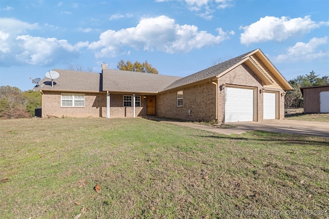 single story home with a garage and a front lawn