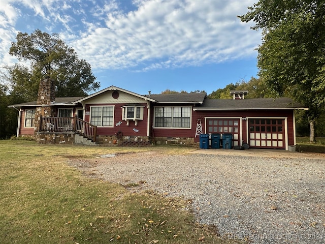 view of front of house with a front lawn and a garage