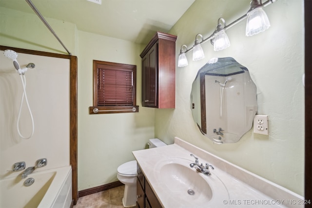 full bath with toilet, vanity, baseboards, and washtub / shower combination