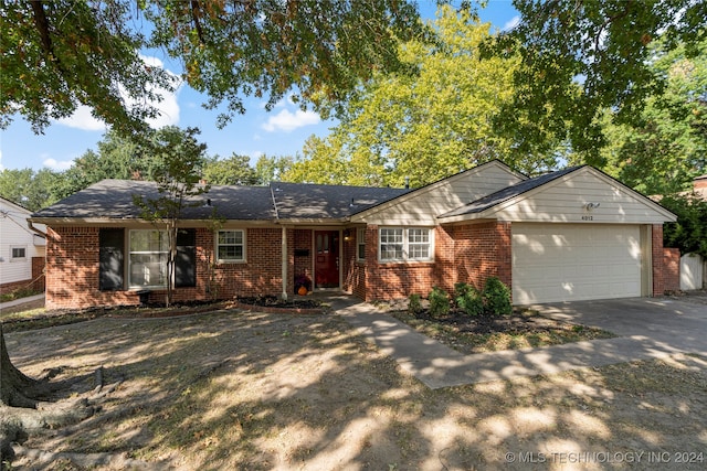 ranch-style house featuring a garage