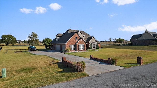 view of front facade featuring a garage and a front lawn