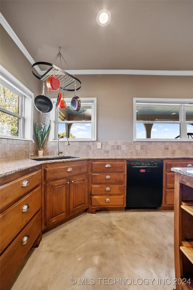 kitchen with ornamental molding, black dishwasher, sink, and backsplash