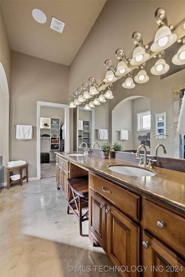 bathroom with vanity and concrete flooring