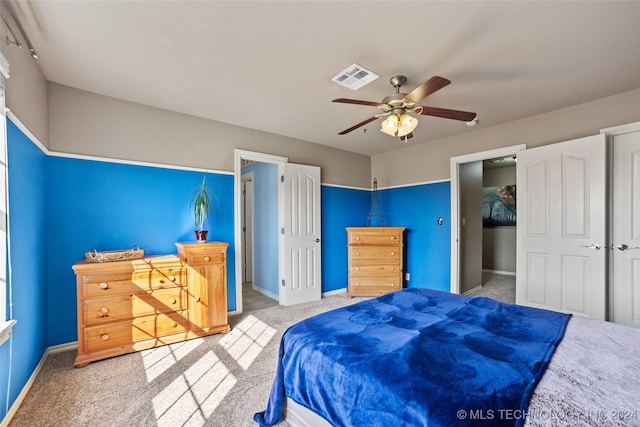 carpeted bedroom with ceiling fan