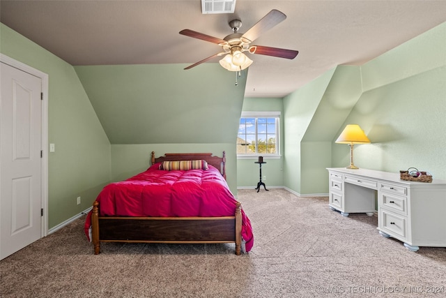 carpeted bedroom featuring vaulted ceiling and ceiling fan