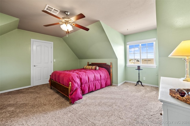 bedroom with lofted ceiling, ceiling fan, and carpet flooring