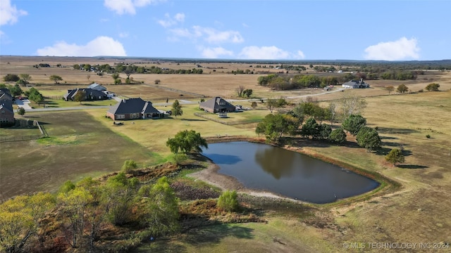 aerial view with a water view and a rural view