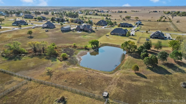 drone / aerial view with a water view and a rural view