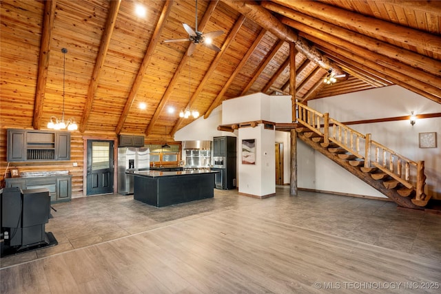 kitchen featuring high vaulted ceiling, wood-type flooring, a kitchen island, wooden ceiling, and beamed ceiling