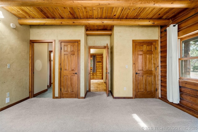 unfurnished bedroom featuring light carpet, rustic walls, beam ceiling, and wood ceiling