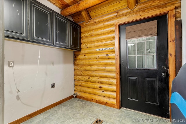 laundry room featuring wood ceiling, cabinets, hookup for an electric dryer, and rustic walls