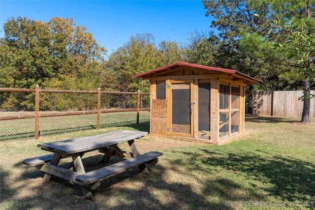 view of outbuilding featuring a yard